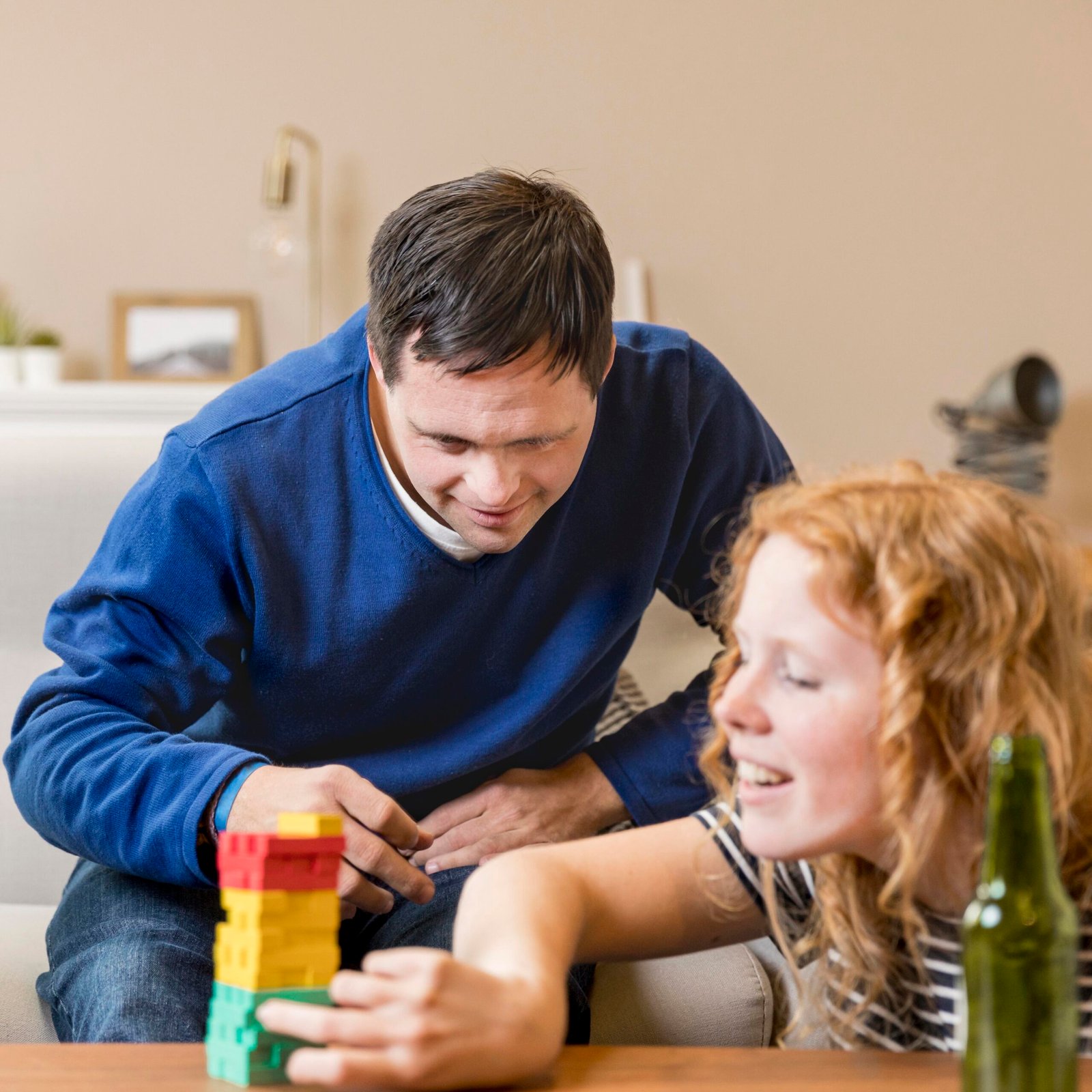 man-woman-playing-games-home-while-having-beer